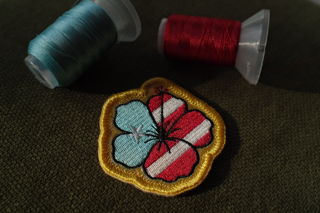 Puerto Rico flag hibiscus embroidered patch

Puerto Rican hibiscus patch with yellow border


Tropical Puerto Rico flower patch on a beach bag

Puerto Rico hibiscus patch backing options


