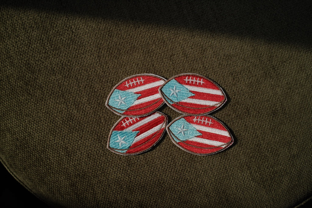 Puerto Rico flag football embroidered patch

Puerto Rican football iron-on patch

Boricua football patch embroidery detail

Puerto Rico football patch displayed on a jersey

Football patch iron-on and sew-on backing options