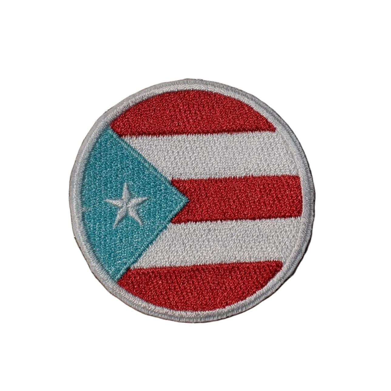 Round patch with a flag design on a brown background