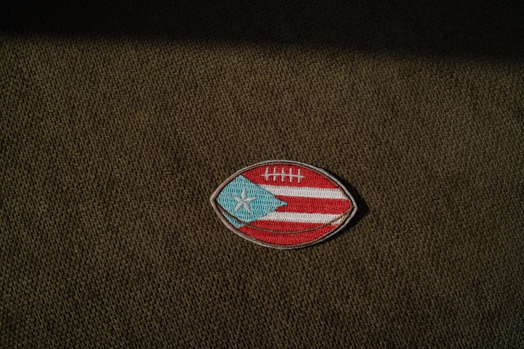 Puerto Rico flag football embroidered patch

Puerto Rican football iron-on patch

Boricua football patch embroidery detail

Puerto Rico football patch displayed on a jersey

Football patch iron-on and sew-on backing options